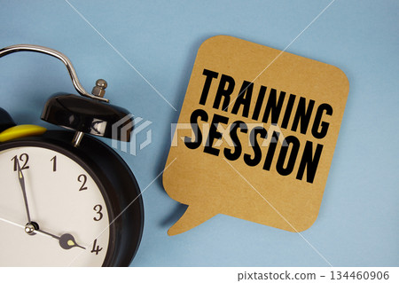 Training Session text with alarm clock on blue background Training Session text with alarm clock on blue background 134460906