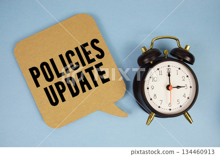 Policies Update text with alarm clock on blue background Policies Update text with alarm clock on blue background 134460913