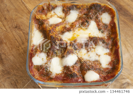 homemade baked pasta with melted mozzarella and meat sauce in dish homemade baked pasta with melted mozzarella and meat sauce in dish 134461746