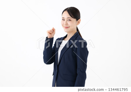 Business woman doing a fist pump Business woman doing a fist pump 134461795