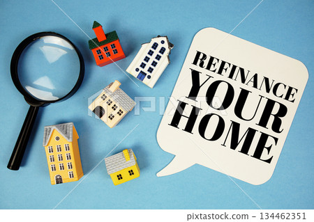 Refinance Your Home text with house models on blue background Refinance Your Home text with house models on blue background 134462351