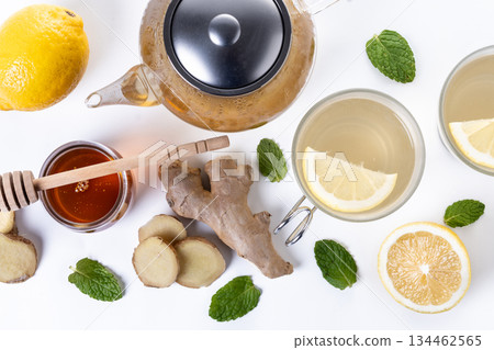 Ginger tea with honey and lemon in a cup Ginger tea with honey and lemon in a cup 134462565