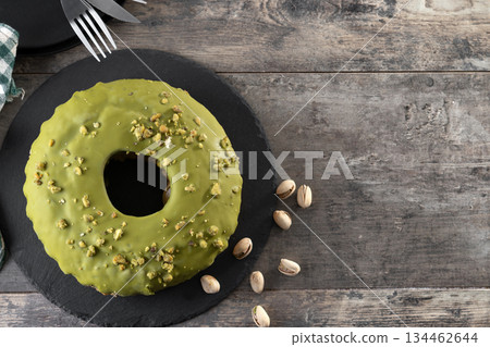 Pistacio cake on wooden table Pistacio cake on wooden table 134462644