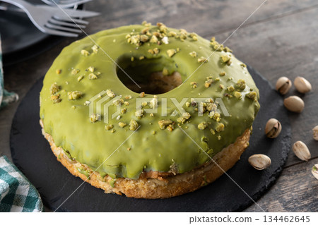 Pistacio cake on wooden table Pistacio cake on wooden table 134462645