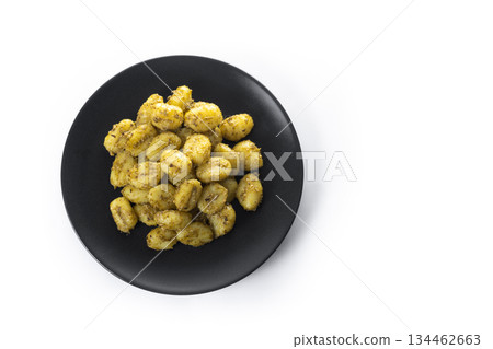 Gnocchi with pesto sauce served on black plate Gnocchi with pesto sauce served on black plate 134462663