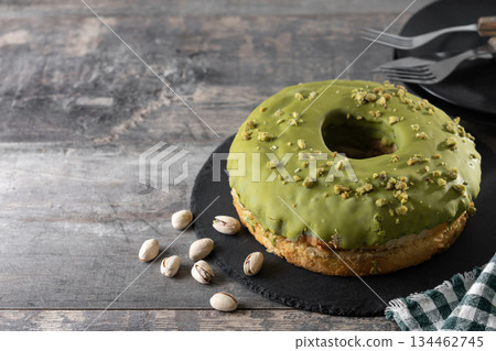 Pistacio cake on wooden table Pistacio cake on wooden table 134462745