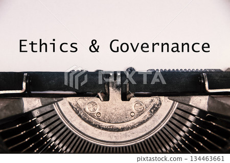 Ethics and Governance text on old typewriter. 134463661
