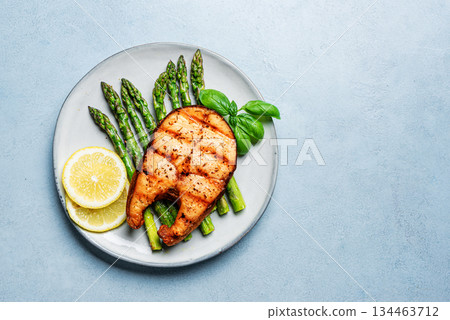 Grilled salmon fish steak and asparagus 134463712