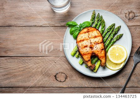 Grilled salmon fish steak and asparagus 134463725