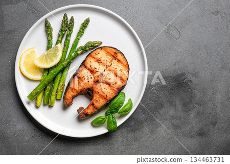 Grilled salmon steak with asparagus Grilled salmon steak with asparagus 134463731