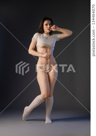 Sensual dance performance by a woman in lingerie showcasing beauty and grace Sensual dance performance by a woman in lingerie showcasing beauty and grace 134464070
