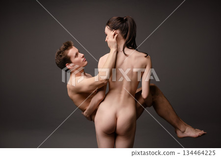 Couple embraces in intimate moment showcasing beauty and connection 134464225