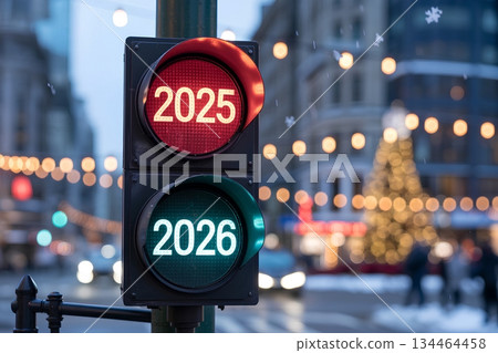 City traffic light showing the transition from 2025 (red) to 2026 (green), symbolizing year-end change, new beginnings and progress 134464458