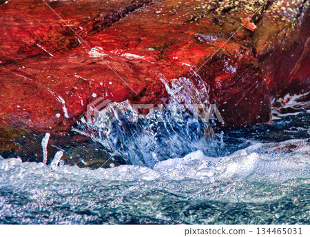 Orange Rock in Clear Flowing River Orange Rock in Clear Flowing River 134465031