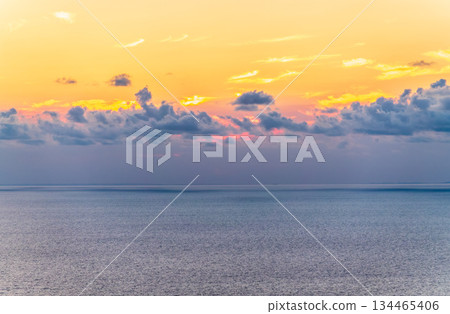 Beautiful pink and orange sunrise over the sea. Beautiful pink and orange sunrise over the sea. 134465406