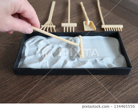 Miniature rock garden out of sand. Meditation and relaxation set for home, tabletop. 134465550