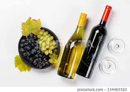 Wine bottles and fresh grapes 134465583