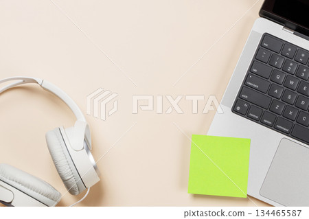 Laptop and stationery on beige workspace, top view with copy space 134465587