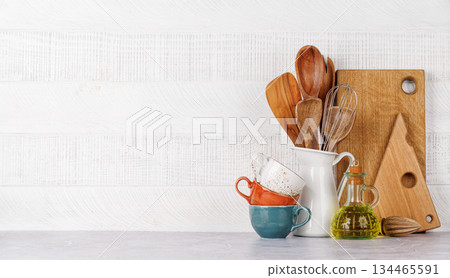 Kitchen utensils and cutting boards on table 134465591