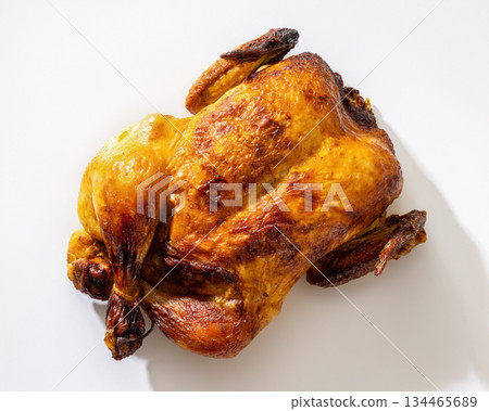 Whole roasted golden chicken on white background 134465689