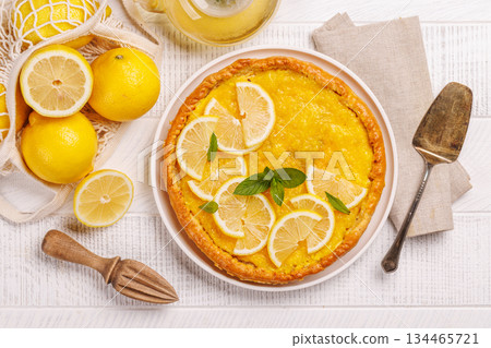 Delicious lemon tart with golden crust and smooth, glossy lemon filling Delicious lemon tart with golden crust and smooth, glossy lemon filling 134465721
