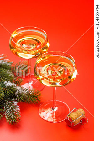 Champagne glasses and snowy fir branches 134465764