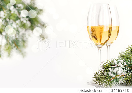 Champagne glasses and snowy fir on white Champagne glasses and snowy fir on white 134465768