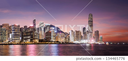 Hong Kong city skyline at sunset with glowing sky and skyscrapers 134465776