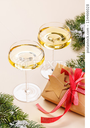 Champagne glasses and snowy fir branches Champagne glasses and snowy fir branches 134466028