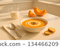 Seasonal Comfort Food: Pumpkin Soup Served with Croutons and Milk 134466209