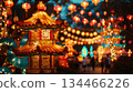 Traditional Chinese lanterns and glowing pagoda structures light up a park during the Lantern Festival. Visual for a cultural article, festival website or evening celebration 134466226