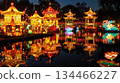 The Chinese Lantern Festival in a park features traditional hanging lanterns and bright pagoda installations. Image for a magazine feature on global holidays or cultural events 134466227