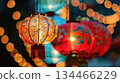 Traditional glowing red lanterns decorate a street park for Chinese Lantern Festival. A magical night atmosphere suitable for event invitations, tourism campaigns, or illustrations of cultural 134466229