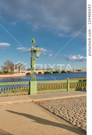 View on the Trinity bridge through iron railings of bridge Saint John at sunset, no people 134466843