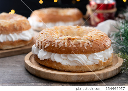 Traditional Spanish Roscon de Reyes with christmas decoration Traditional Spanish Roscon de Reyes with christmas decoration 134466957