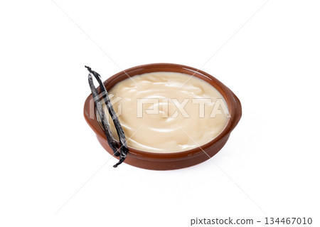Creamy homemade Spanish custard served in a bowl with cinnamon Creamy homemade Spanish custard served in a bowl with cinnamon 134467010