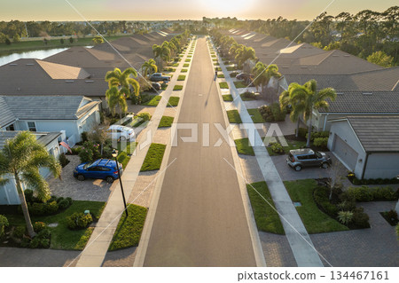 American gated community houses in rural US suburbs. View from above of large residential homes in small town in southwest Florida American gated community houses in rural US suburbs. View from above of large residential homes in small town in southwest Florida 134467161
