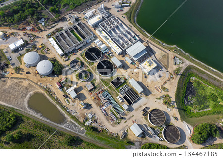 Aerial view of water treatment factory at city wastewater cleaning facility. Purification process of removing undesirable chemicals, suspended solids and gases from contaminated liquid 134467185