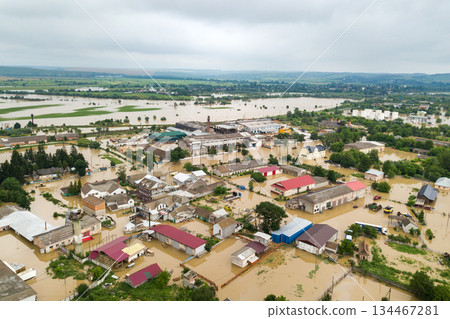 Aerial view of flooded houses with dirty water of Dnister river in Halych town, western Ukraine. Aerial view of flooded houses with dirty water of Dnister river in Halych town, western Ukraine. 134467281