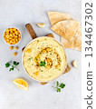 Lupin hummus with olive oil parsley, pita bread, garlic on white background Top view. Vegan food. 134467302