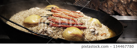 Aromatic pilaf is fried in a cauldron Aromatic pilaf is fried in a cauldron 134467780