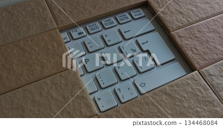 The command buttons and enter key in a hole of solid brickwork. Computers security illustration concept image The command buttons and enter key in a hole of solid brickwork. Computers security illustration concept image 134468084