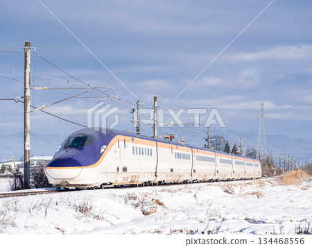 [Yamagata Line] Shinkansen Tsubasa train running through the winter countryside 134468556