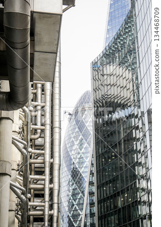 Modern Urban Architecture with Steel Pipes and Glass Skyscrapers Modern Urban Architecture with Steel Pipes and Glass Skyscrapers 134468709