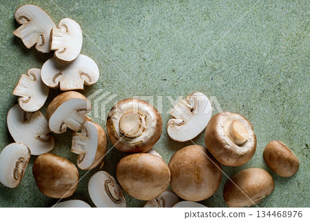 fresh mushrooms on green background fresh mushrooms on green background 134468976