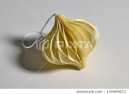 yellow paper Christmas ornament 134469011