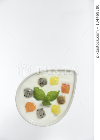 Yogurt topped with diced mix Yogurt topped with diced mix 134469580