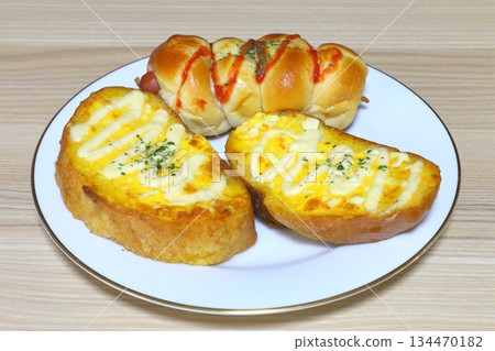 Breakfast (egg baguette and sausage roll) Breakfast (egg baguette and sausage roll) 134470182