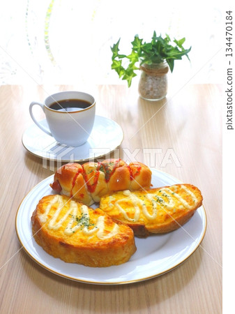 Breakfast (egg baguette and sausage roll) and coffee [vertical composition] 134470184