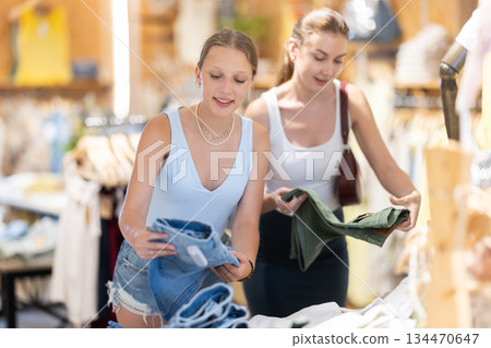 Two women choosing shorts in clothing store 134470647